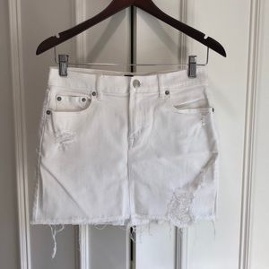 White denim mini skirt from Gap. Fringe.